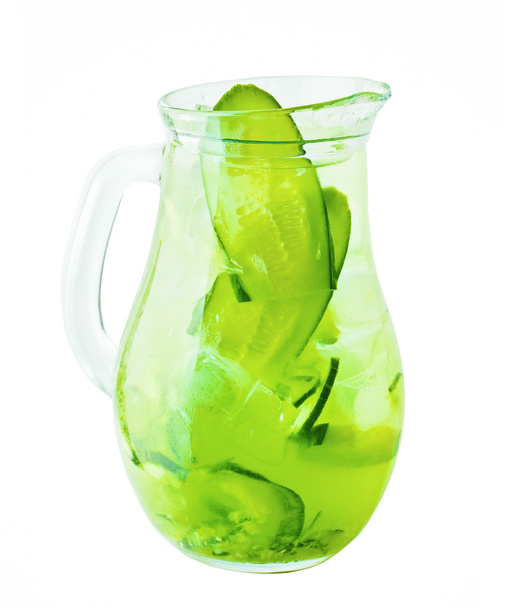 Lemonade Pitcher. Сucumber Lemonade Drink with Ice and Herbs - 写真・画像
