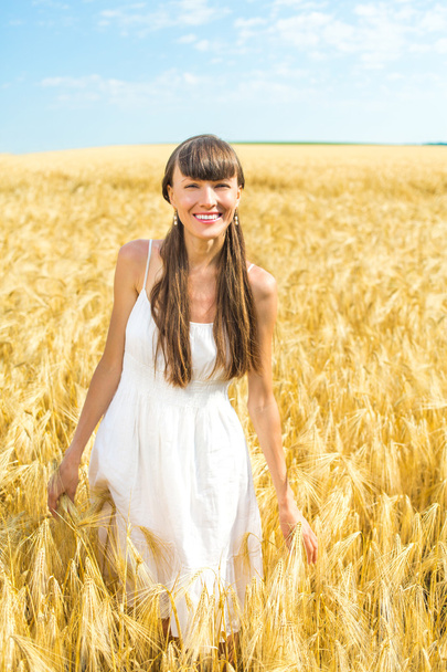 girl enjoy nature in the wheat field - 写真・画像