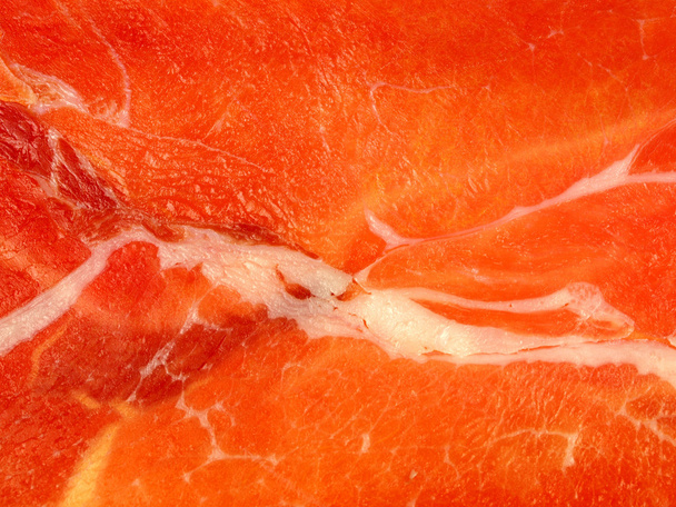 A slice of jamon background - Photo, Image