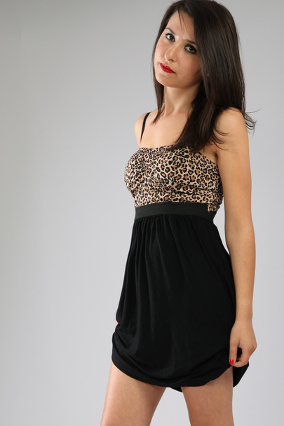 Nice girl in leopard mini dress - Foto, imagen