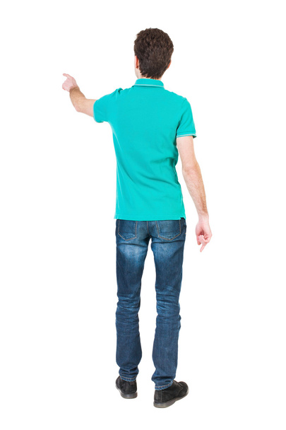 Back view of  pointing young man - Foto, Imagem