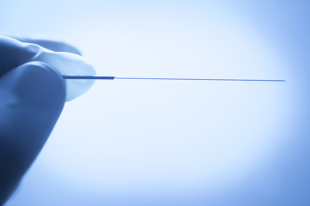 Doctor hand acupuncture needle dry needling - Fotó, kép