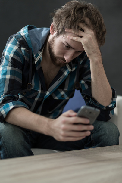 Really sad man using phone - Foto, Bild