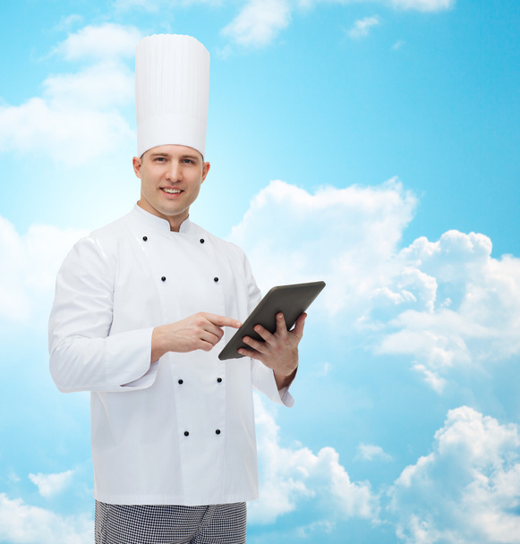 happy male chef cook holding tablet pc - 写真・画像