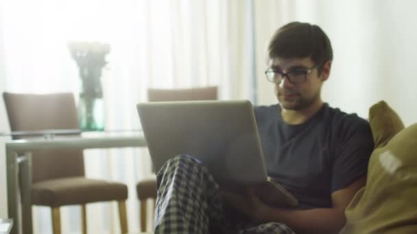 Man is Using Laptop at Morning at Home. - Кадри, відео