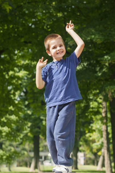 Playful boy posing outdoors - Фото, зображення