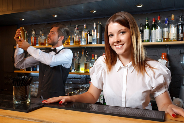 Bartender and a waitress during work - Valokuva, kuva