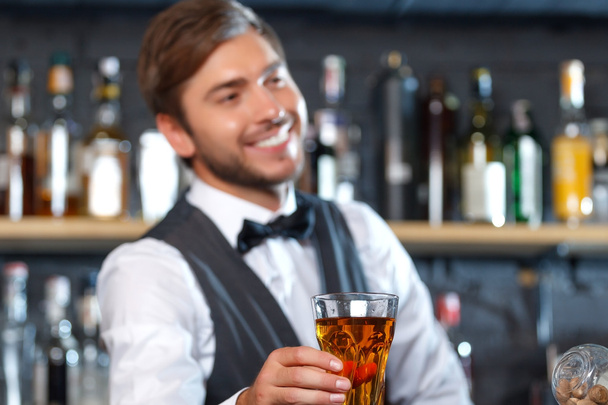 Handsome bartender during work - Foto, imagen