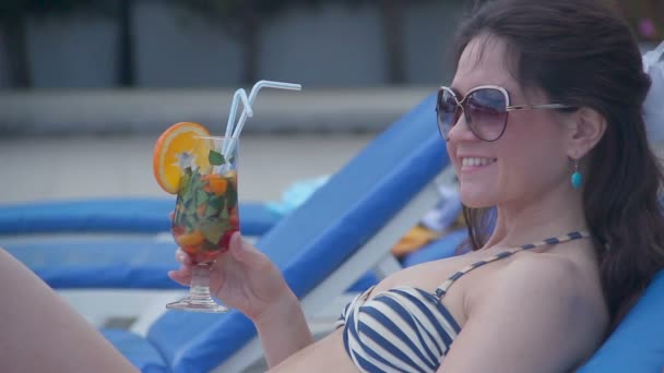 Young brunette beauty flirting on beach, smiling, hanging out - Felvétel, videó