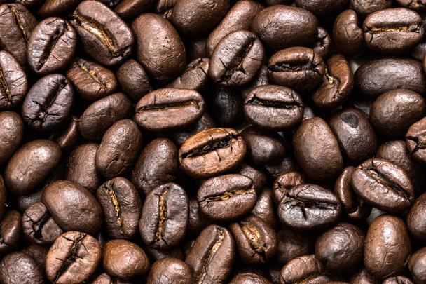 Крупним планом кавові зерна смажені
. - Фото, зображення
