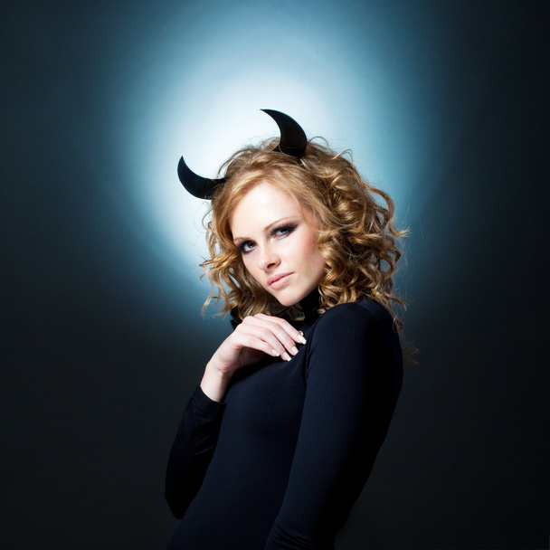 The beautiful young girl a devil - Photo, Image