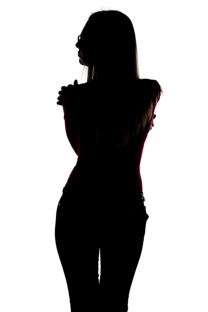 Silhouette de femme mince étreinte de dos
  - Photo, image