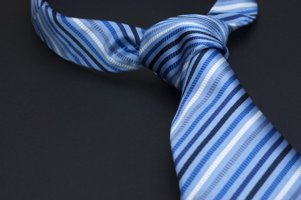 Man's tie on a black background - Photo, Image