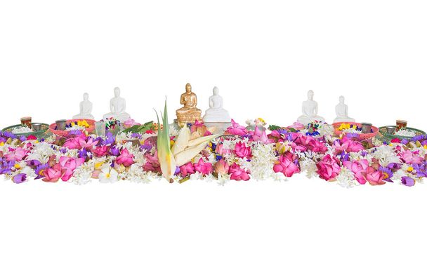 Ceremonial flowers and buddha figurines - Φωτογραφία, εικόνα