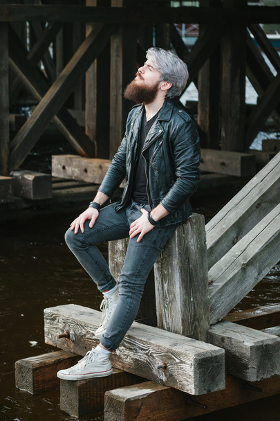 Bearded hipster with nose ring in leather jacket - Foto, imagen