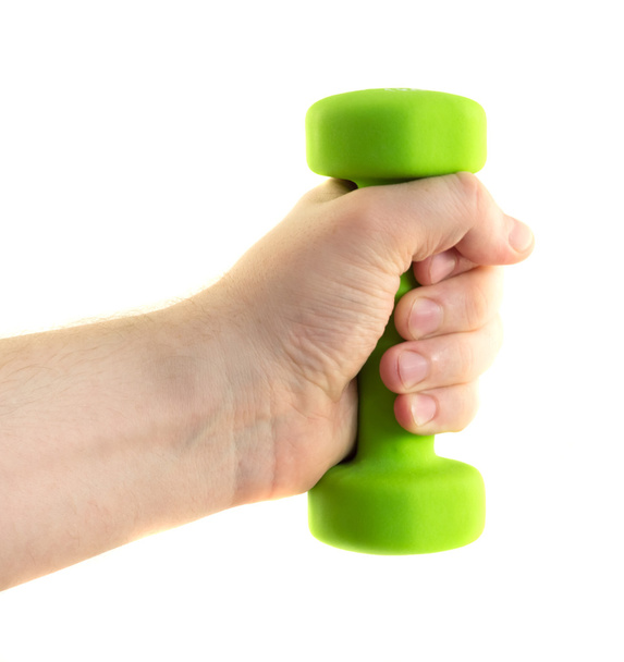 Hand fingers holding a dumbbell green fist - Fotó, kép