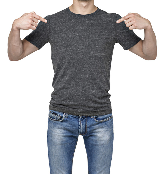 Close-up of a man pointing his fingers on a blank grey t-shirt. Isolated. - Foto, Imagen