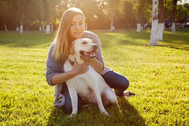 Beautiful woman with her dog. Labrador retriever - Φωτογραφία, εικόνα