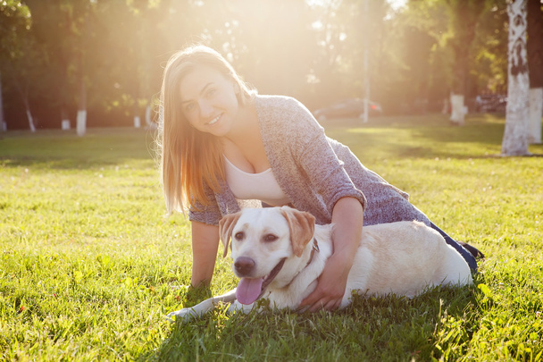 Beautiful woman with her dog. Labrador retriever - Zdjęcie, obraz