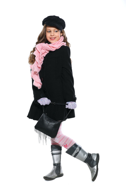 A little beautiful girl is in autumn clothes, isolated on a white backgroun - Fotó, kép