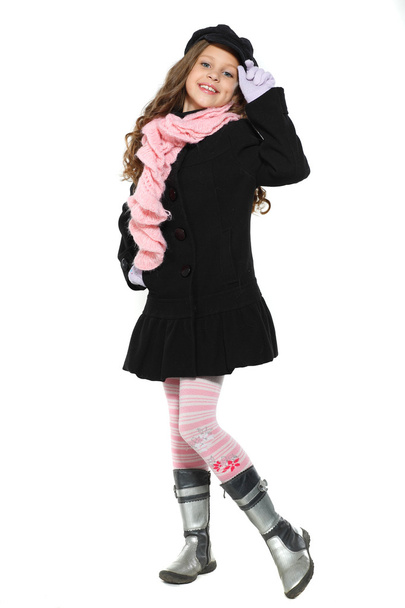 A little beautiful girl is in autumn clothes, isolated on a white backgroun - Valokuva, kuva