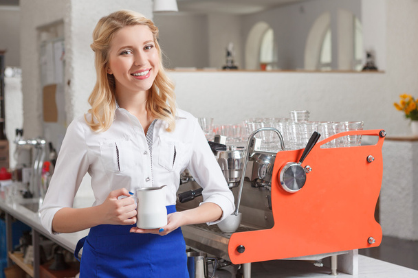 Portrait of young smiling female barista - Photo, image