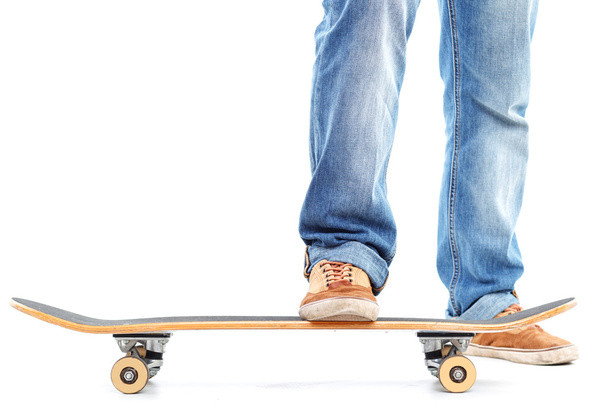 Close up of man using skate board - Foto, afbeelding