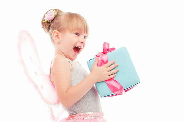Pleasant little girl holding present  - Foto, Bild