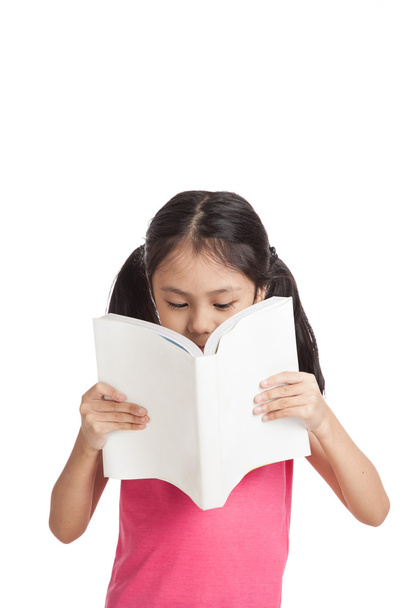 Happy little asian girl  read a book - Fotografie, Obrázek