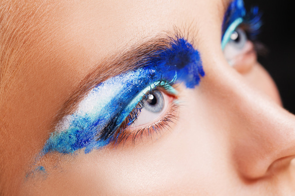 Close-up view of woman blue eye with beautiful make-up. Perfect Make-up closeup. - 写真・画像