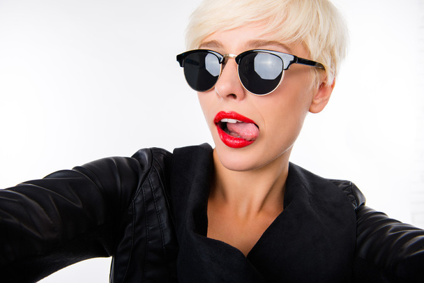Girl making selfie with red lips and sunglasses  - Фото, зображення