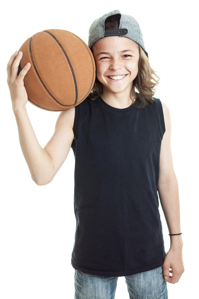 Portrait of young boy with basket ball - 写真・画像