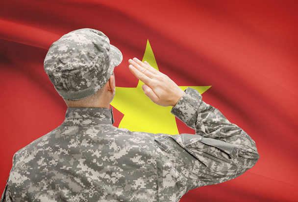 Soldat im Hut vor Nationalflagge Serie - Vietnam - Foto, Bild