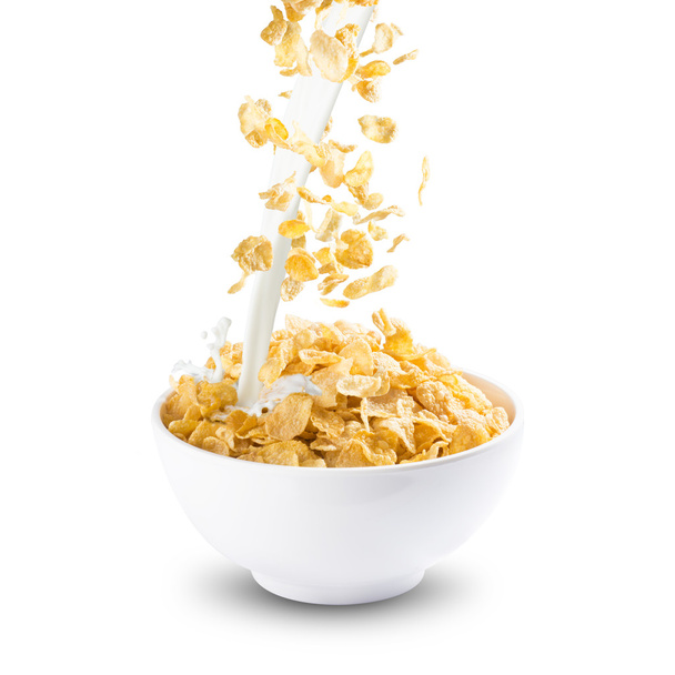Corn Flakes and Milk Splash on Bowl - Фото, изображение