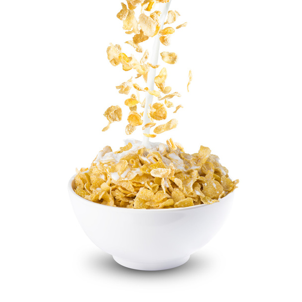 Corn Flakes and Milk Splash on Bowl - Photo, image