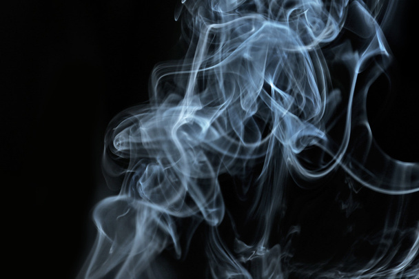 Color smoke from match on dark background - Фото, изображение