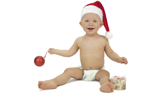 Little Santa with gift box and Christmas bauble - Foto, imagen