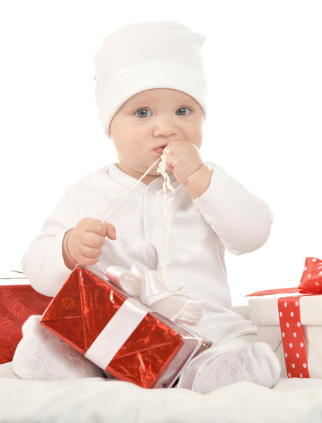 cute baby girl   with gifts - Foto, immagini