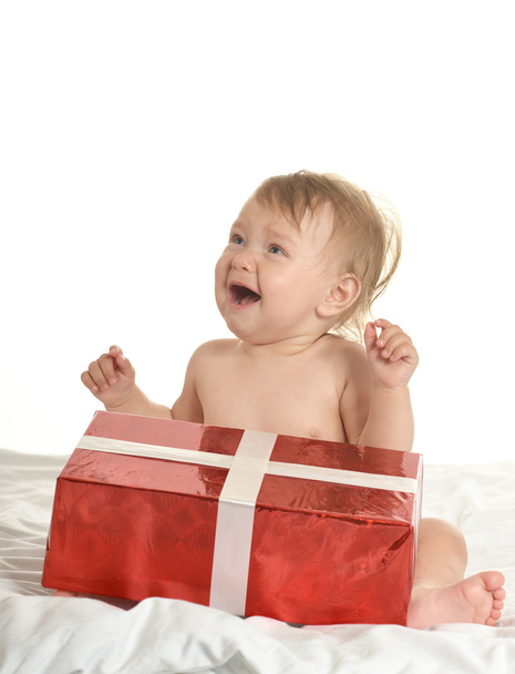 Cute crying  baby girl with gift - Fotó, kép