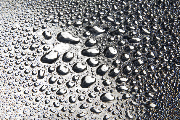 Water drops on polished metal surface - Foto, Imagen