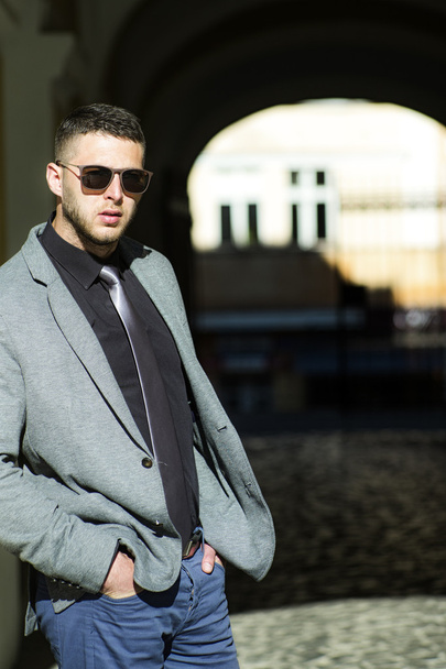 Handsome well dressed brunette in sunglasses - Photo, image