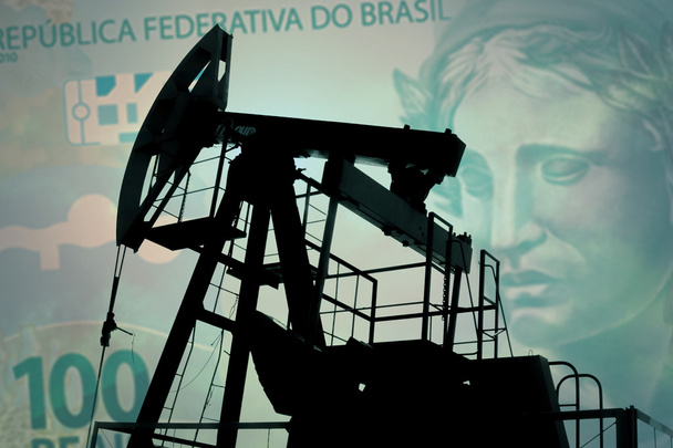 Bomba de aceite con billete brasileño
 - Foto, imagen