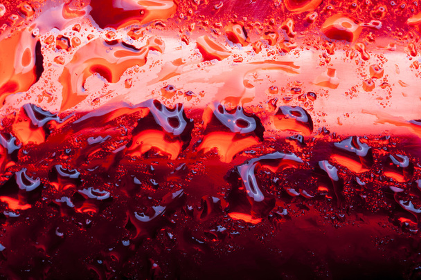 Water drops on red metal surface - Foto, imagen