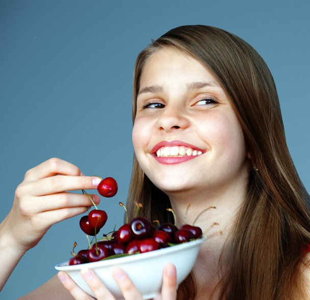 Teenage girl with cherries - Photo, image