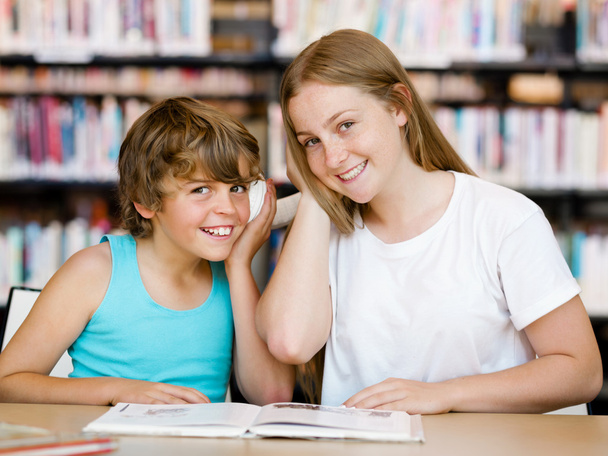 Teenage girl and her brother with books - Foto, imagen