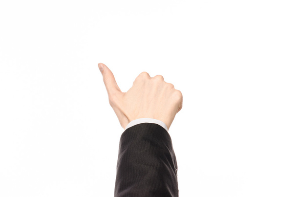 Gestures and Business theme: businessman shows hand gestures with a first-person in a black suit on a white background isolated - Photo, image