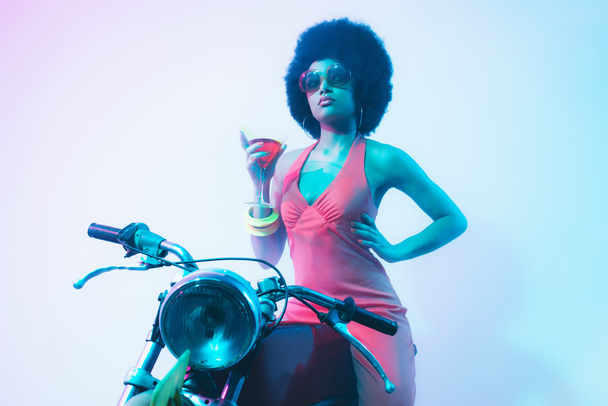 Elegant Lady with Cocktail on her Motorcycle - 写真・画像