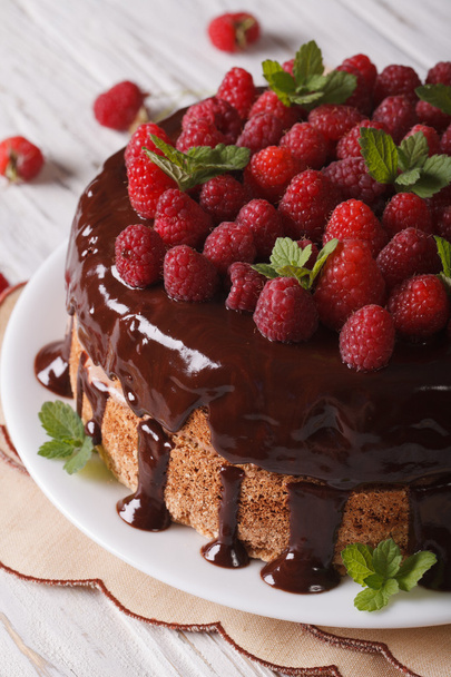 Chocolate cake with fresh raspberries close-up vertical - 写真・画像