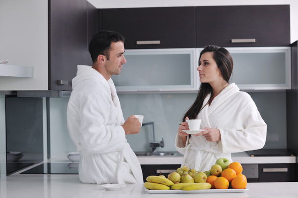 Young couple have fun in modern kitchen - Foto, imagen
