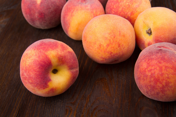 Group of peaches on a dark background - Foto, imagen